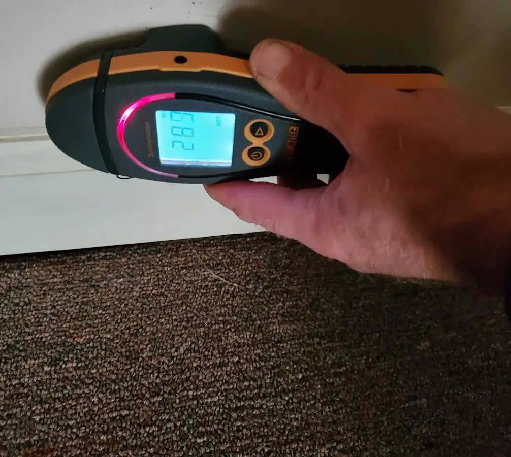 Moisture detection at baseboard during Burst Pipe Cleanup in Old Bridge